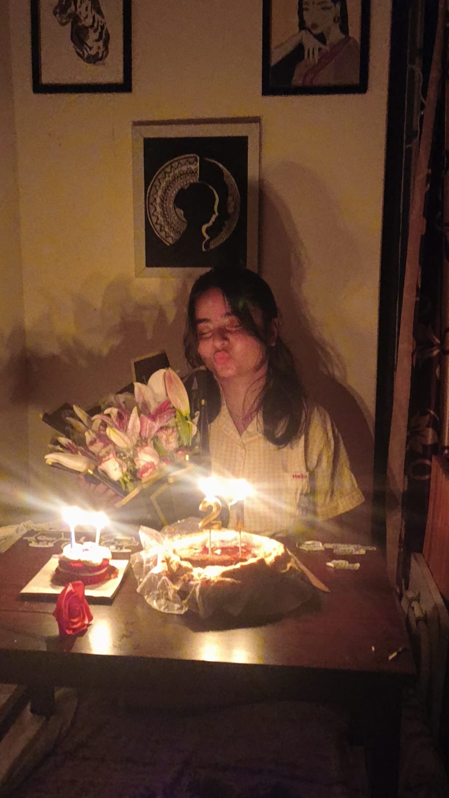Ritika celebrating her birthday by candlelight
